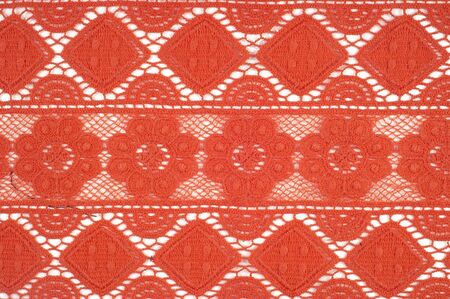 Red lace fabric texture Photo taken in the studio