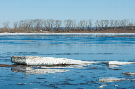 River With Broken Ice. ice hummocks on the river in spring. landscape close-up ice drift on the river in the spring on a sunny dayの写真素材