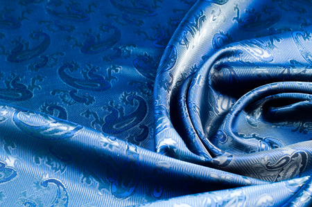 The texture of the silk fabric. Dark blue. 