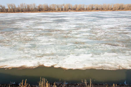 Spring River, the ice on the river. picturesque spring landscape with river ice melted bare trees...