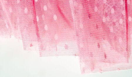The texture of fabric lace with sequins on fabric background. a small, shiny disk sewn as one of...