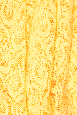 The texture of fabric lace, bright yellowの写真素材