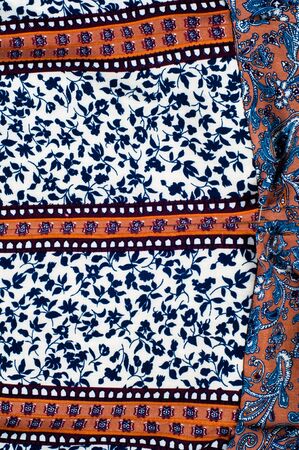 The texture of the silk fabric is white with small blue flowers