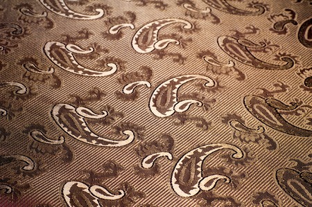Fabric silk texture color Sandy Brown. With woven into the fabric flowersの写真素材