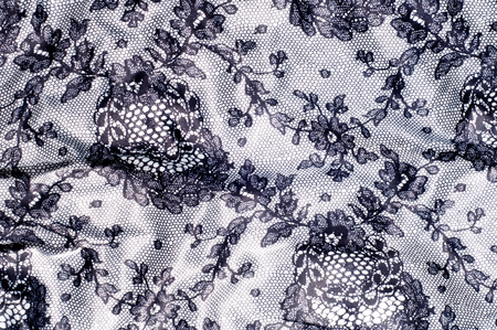 Texture lace fabric. lace on white studio. thin fabric made of yarn or thread. typically one of cotton or silk, made by looping, twisting, or knitting thread in patternsの写真素材