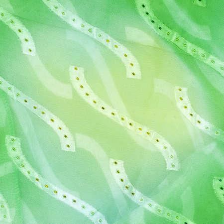 Silk fabric texture, background. green and yellow colorの写真素材