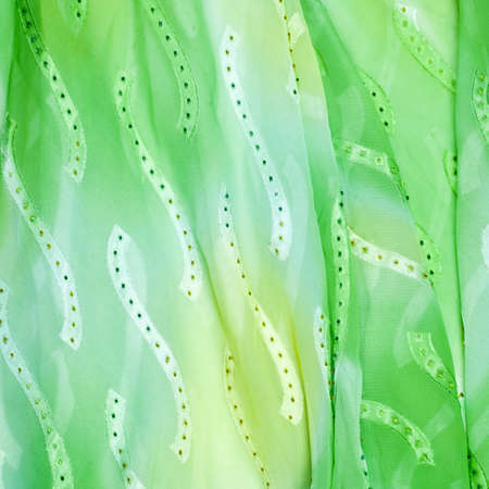 Silk fabric texture, background. green and yellow colorの写真素材