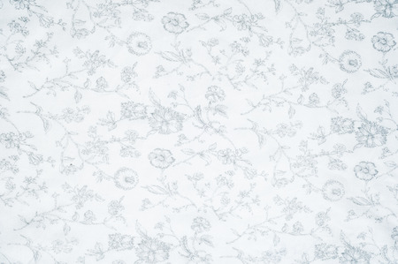 Cotton fabric texture, background, white, with painted flowers. a soft white fibrous substance that...