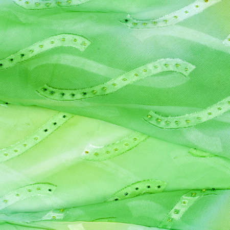 Silk fabric texture background. green and yellow colorの写真素材
