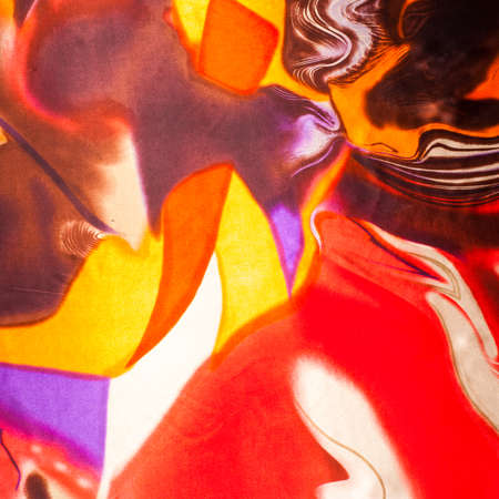 Fabric colors abstraction, with a pattern of yellow,  red . Photography Studio