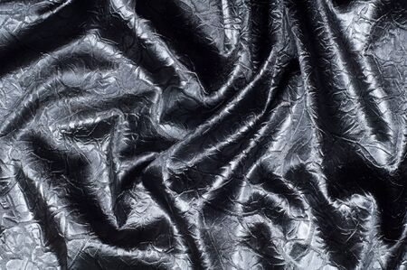 Fabric texture silk black. With gray spots. abstraction