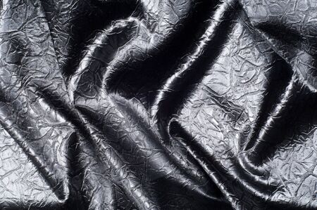 Fabric texture silk black. With gray spots. abstraction