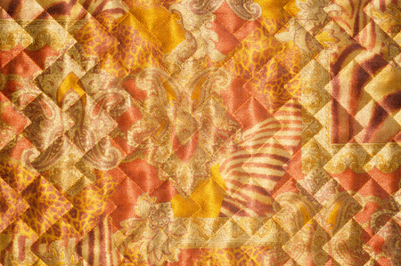 Fabric texture silk black.  abstraction. The texture of the fabric cloth quilted jackets