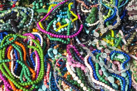 bead, chaplet, beading. a small piece of glass, stone, or similar material, typically rounded and...