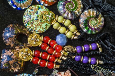 bead, chaplet, beading. a small piece of glass, stone, or similar material, typically rounded and perforated for threading with others as a necklaceの写真素材