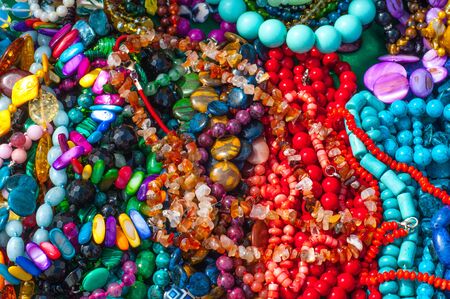 Texture, background. bijouterie, imitation jewelry. jewelry or trinkets. Women's jewelry made of...
