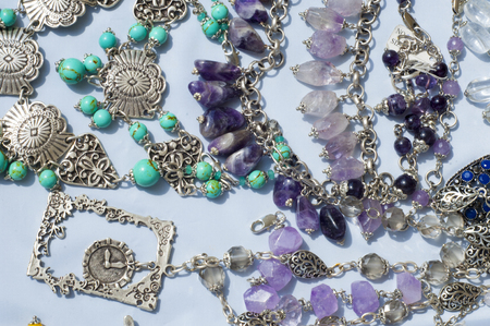 bead, chaplet, beading. a small piece of glass, stone, or similar material, typically rounded and perforated for threading with others as a necklaceの写真素材