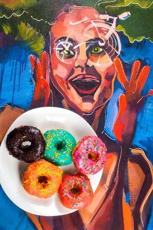 doughnut, dough-boy, sinker, fritter. a small fried cake of sweetened dough, typically in the shape of a ball or ring.の写真素材