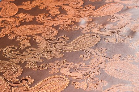 fabric texture red brown, terracotta. Painting on silk cloth. Thai painting pattern of golden brown...