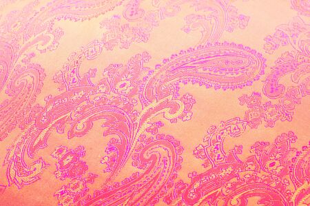 Fabric silk texture gold color, red and yellow pattern. folds of golden silk fabric, texture, background. Yellow fabric silk texture for background . Smooth elegant golden silkの写真素材