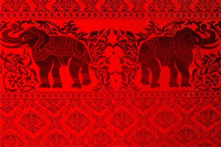 Red silk fabric texture, pattern. Red silk fabric background. red silk textile with golden lines. abstract red silk fabric texture for background. can use as backgroundの写真素材