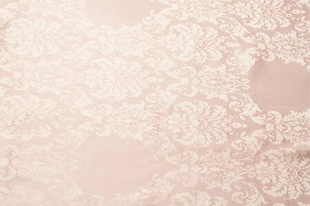 The texture of the silk fabric of beige with small white patternの写真素材