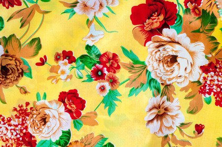 Texture, background. textiles. cotton cloth. bedding, flowers on a yellow backgroundの写真素材