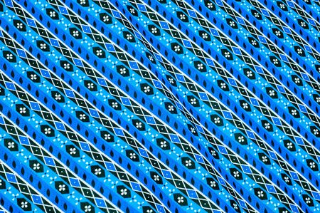 Texture, background. textiles. cotton cloth. bedding, curly blue stripe pattern on the fabricの写真素材