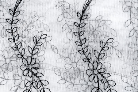 Texture, background. Tulle white with black stains of colors