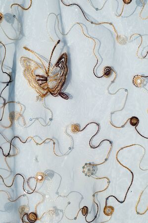 Texture, background. Tulle, organza. Beautiful patterns with butterfliesの写真素材