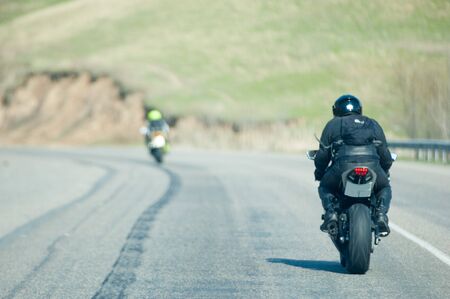 Country road in spring. road winds between hillsの写真素材