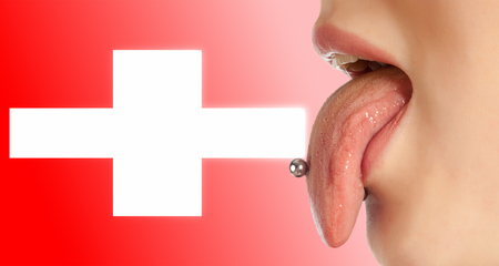 Tongue. The body in the mouth, which is the organ of taste, while also contributing to the formation of human speech sounds. Swissの写真素材