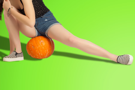 Green background Chroma Key. Legs Ass Back Hand. The girl in the studioの写真素材