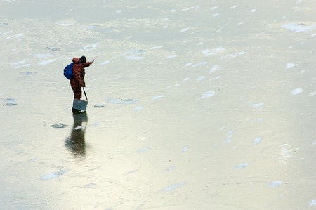 ice on the river. ice texture of ice skating rink outdoors with snow. Ice in winter frozen river backgroundの写真素材