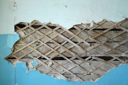 Texture, background. plaster. photographed close-up of a crack in the plaster walls of the old building. damaged plaster wallの写真素材