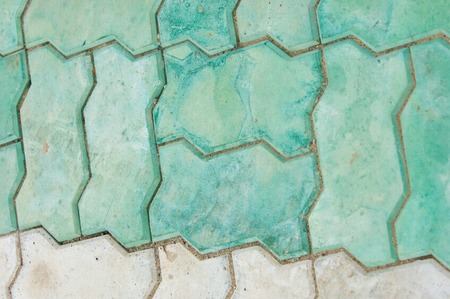 tile texture stones Square. Stone paving texture. Abstract structured background. Brick pavement. Brick worm on the walkwayの写真素材
