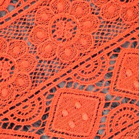 Red lace fabric texture Photo taken in the studio
