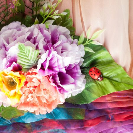 Pink fabric inlaid flowers. texture. Photographed in the studioの写真素材