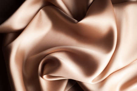 tissue, textile, cloth, fabric, material, texture. beige color. cloth, typically produced by weaving or knitting textile fibers.の写真素材