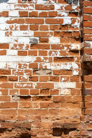 Texture, background. Brick wall. Fragment of Venetian old brick wall as background. Red brick wall texture background. Old brick wall texture backgroundの写真素材