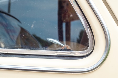 31.07 2015 Russia Tatarstan. Yelabuga, Spasskaya Fair. vintage car. Close up shot of a vintage car in sepia color toneのeditorial素材