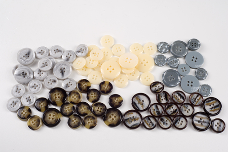 Texture, background, sewing buttons collection. Various sewing buttons with a thread. isolated. ...