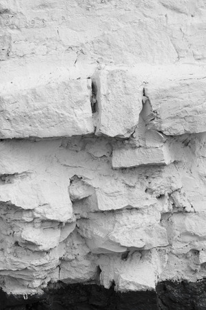 Texture, background. a wall lined with stone, whitewashedの写真素材