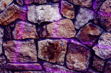 Texture, background. Fence lined with wild stone, granite, sandstoneの写真素材