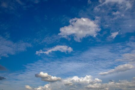 clouds. a visible mass of condensed water vapor floating in the atmosphere, typically high above the...