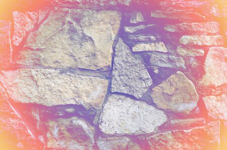 Texture, background, pattern. Natural stone lined wall. Hard rock chunks or solid mass, as well as a piece, vertical part of the building premises.の写真素材