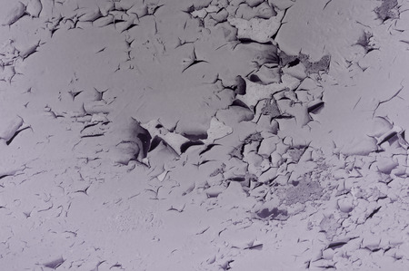 old paint on a concrete wall. Old painted wall. Cracking and peeling paint on a wall. Cracks Effect...