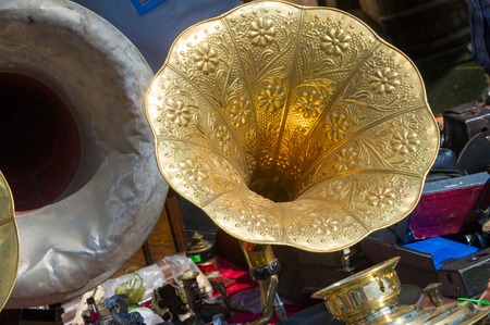 Flea market, antiques, old gramophones, ancient records with music and songs. Vintage ironsの写真素材