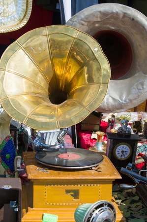 Flea market, antiques, old gramophones, ancient records with music and songs. Vintage ironsの写真素材