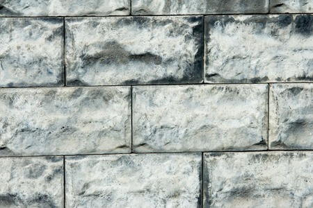 Texture, background. decorative brick, building decoration. a small rectangular block typically made...